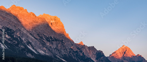 Alpenglow in the Dolomites during sunset - banner