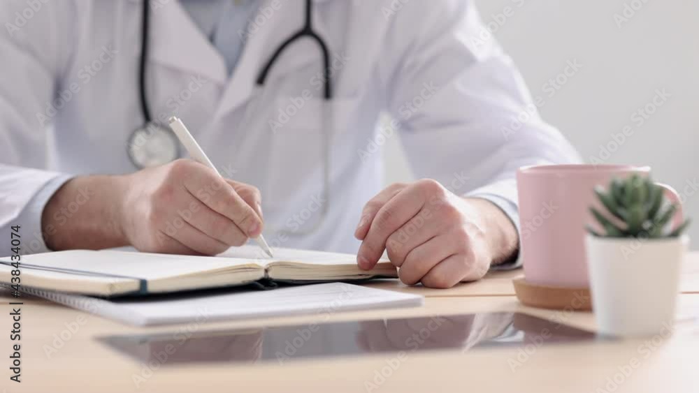a doctor in a white coat in his office at a medical clinic makes an entry in his diary, a doctor works after seeing patients at a computer, a European man in a doctor's robe makes a record of the a doctor in a white coat in his office at a medical clinic makes an entry in his diary, a doctor works after seeing patients at a computer, a European man in a doctor's robe makes a record of the