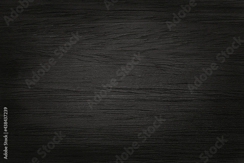 Black wooden wall background, texture of dark bark wood with old natural pattern for design art work, top view of grain timber.