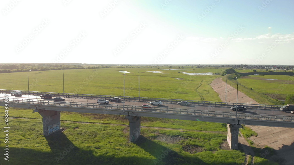 Boat Floats On River Under Bridge