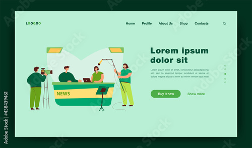 Two journalists sitting at desk on TV studio isolated flat vector illustration. Cartoon professional crew cameraman shooting interview show or news. Entertainment and backstage concept