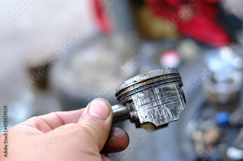 Damaged motorcycle engine piston rings from use.
