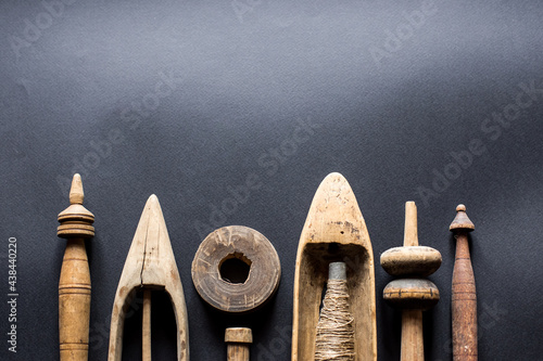 Old vintage primitive wood parts of shuttles hand weaving loom, antique wooden hand loom