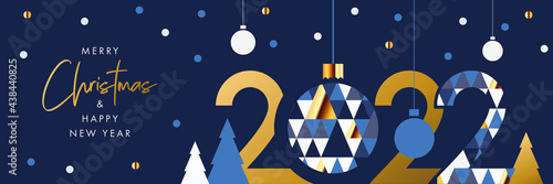 Merry Christmas and Happy New Year banner, greeting card, poster, holiday cover, header. Modern Xmas design in geometric style with triangle pattern, Christmas tree, ball, snow and 2022 number on blue