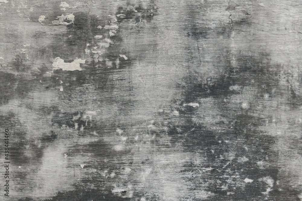 Obraz premium abstract gray painted old wall for background or texture, peeling paint and stucco with cracks like grunge style
