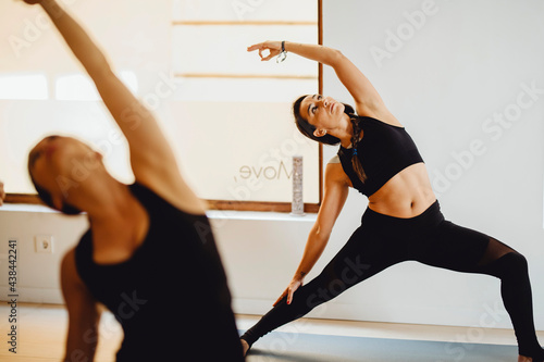 Young women practicing yoga lesson photo