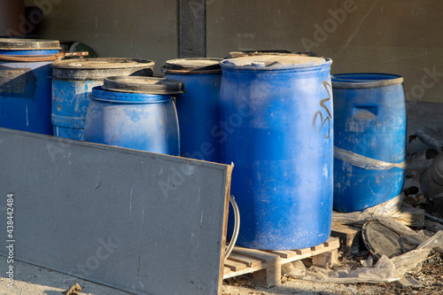 Olona Valley (VA), Italy - April 01, 2021: Olona Valley old drums near a factory. © PaoloGiovanni