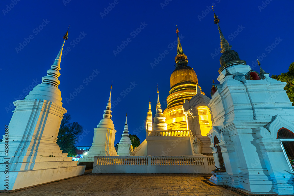 Naklejka premium Wat Suan Dok is a Buddhist temple (Wat) at twilight night sky background is a major tourist attraction in Chiang Mai Northern Thailand.Travels in Southeast Asia.