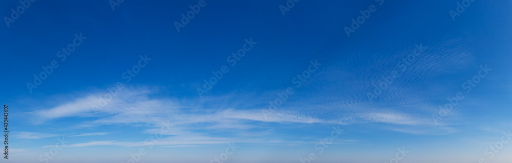 Fototapeta premium Blue Sky background with tiny Clouds. Panorama background