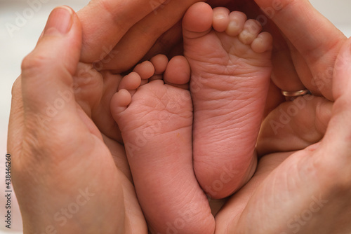 baby feet in mother hands