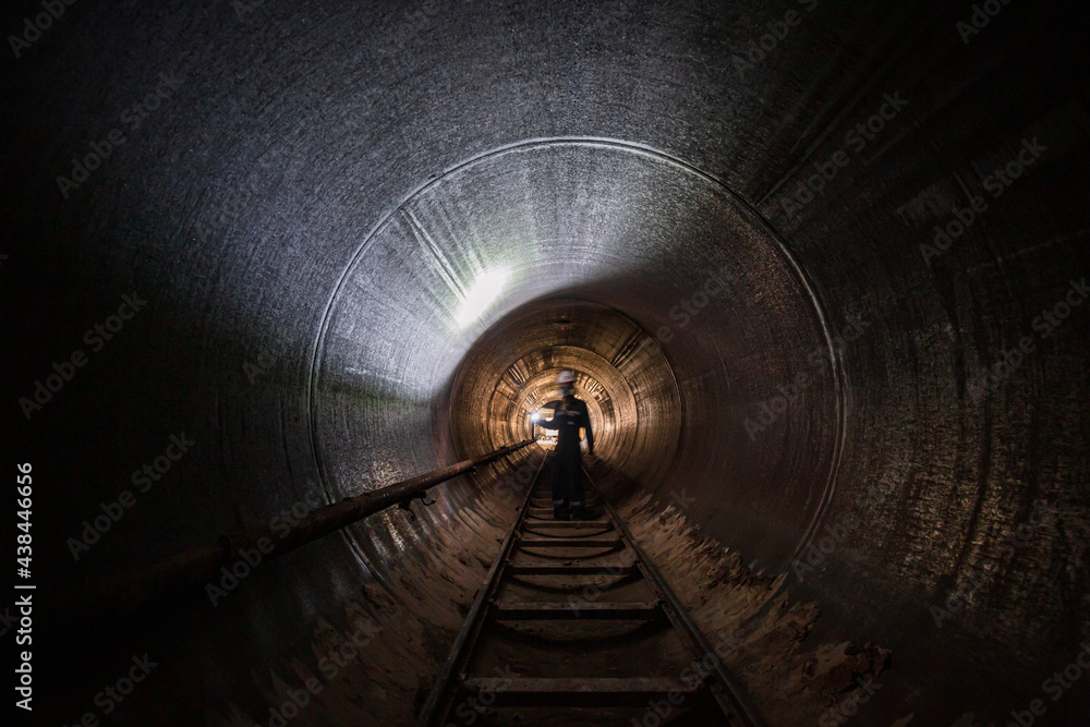 Working male inspection weld underground of equipment tunnel