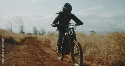 Wallpaper Mural Woman riding electric dirt bike, adventure active outdoor lifestyle, cinematic slow motion Torontodigital.ca