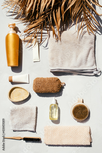 Beautiful photo of spa and skin care products such as oil, cream and other organic products, towels shot in flat lay style on sunlight with contrast shadows