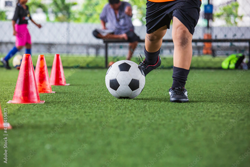 Obraz premium Children playing control soccer ball tactics on grass field with for training