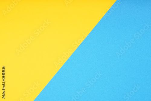 two color paper background in yellow and blue