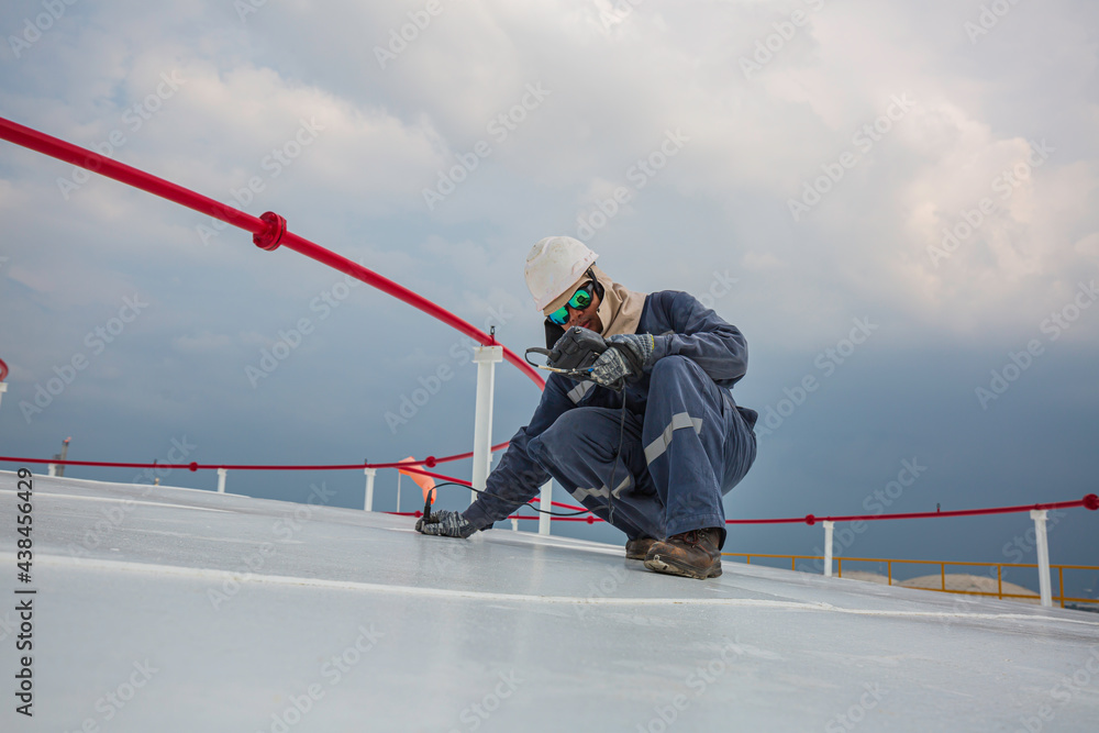 Male worker are for inspection ultrasonic thickness roof plate top Male worker are for inspection ultrasonic thickness roof plate top