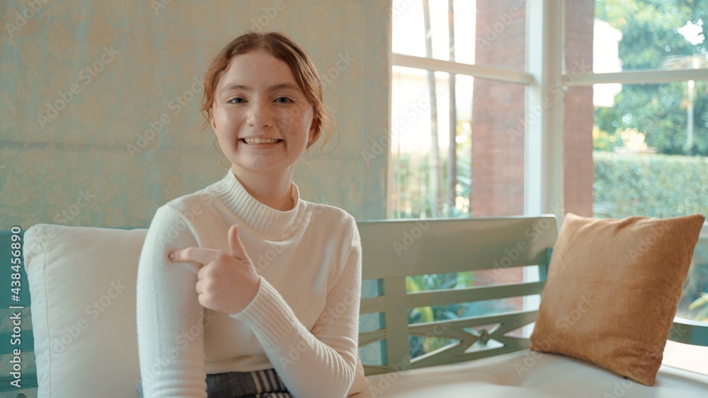 A young Caucasian girl points to an arm that has been vaccinated COVID-19 or coronavirus certificate, immunity vaccine passport, new normal travel of tourist concept. A young Caucasian girl points to an arm that has been vaccinated COVID-19 or coronavirus certificate, immunity vaccine passport, new normal travel of tourist concept.