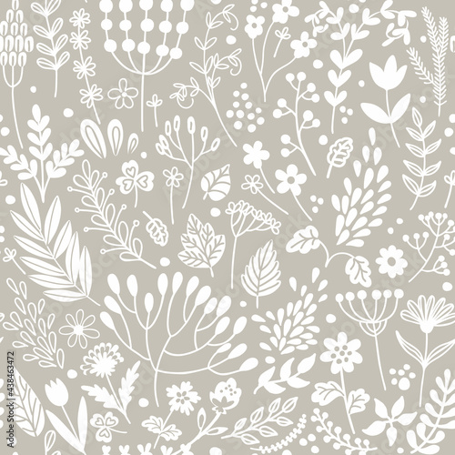 Floral seamless pattern. Silhouettes of flowers, leaves and berries on a beige background. Decorative print. Plant texture for fabric, wrapping, wallpaper and paper