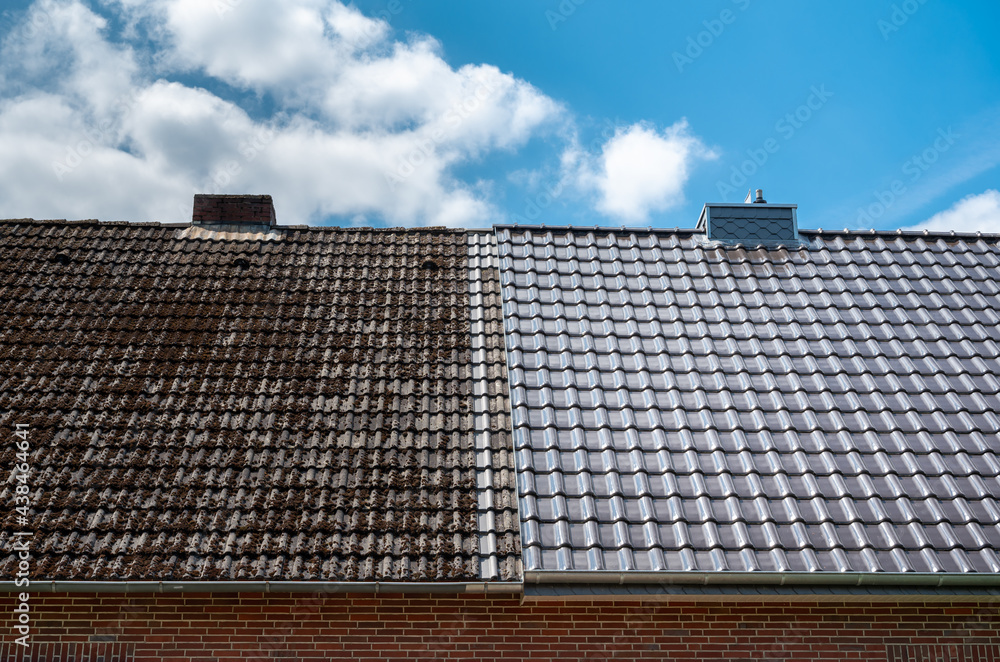 A half cleaned house roof shows the before and after effect of a roof cleaning. - obrazy, fototapety, plakaty 