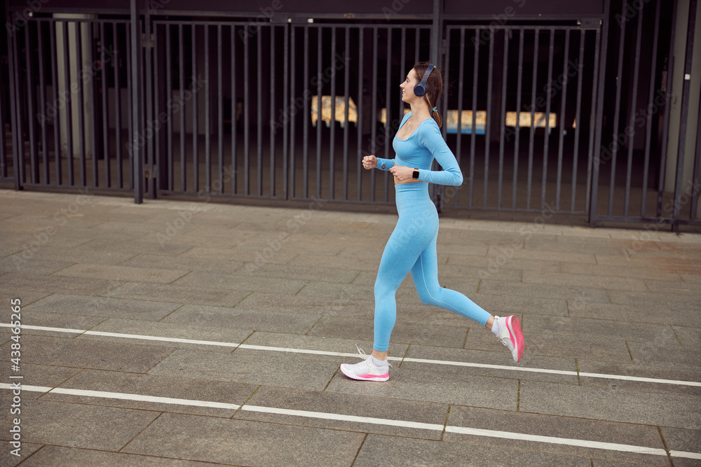 Fototapeta premium happy beautiful caucasian woman at workout in urban city