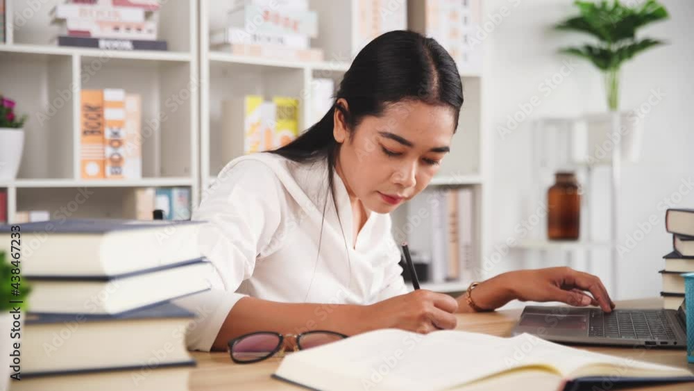 Beautiful young woman working in the office. woman working laptop. Business woman busy working on laptop computer at office. Beautiful young woman working in the office. woman working laptop. Business woman busy working on laptop computer at office.