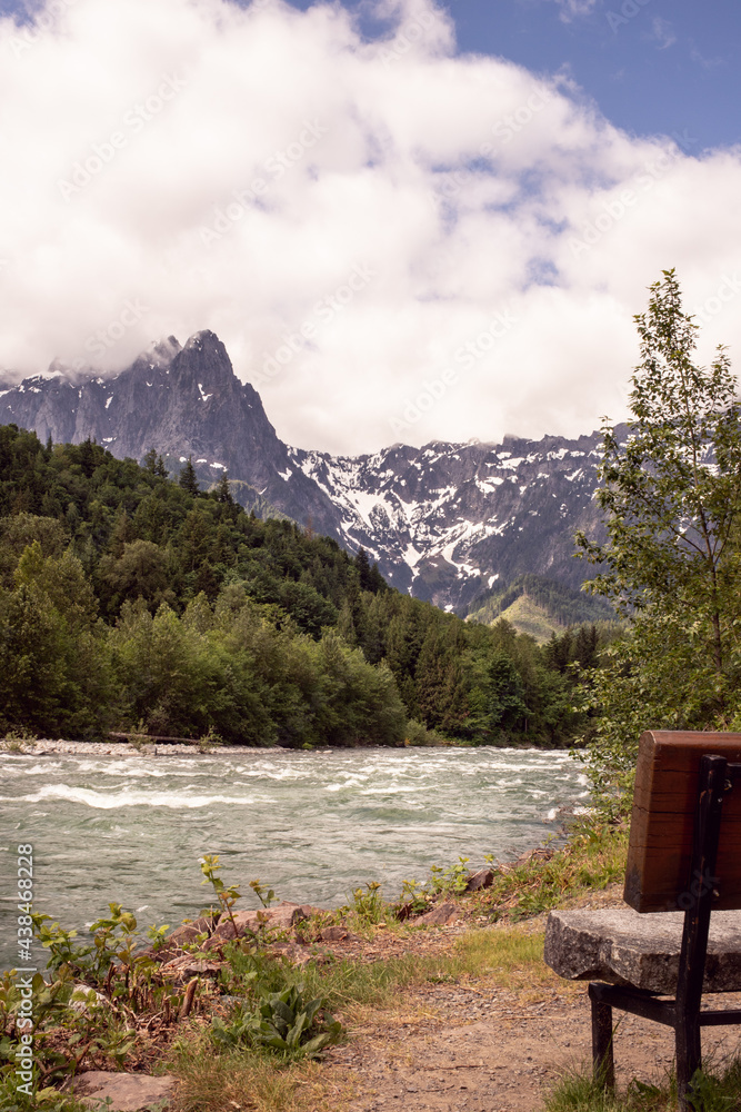 bench by the river in the mountains bench by the river in the mountains