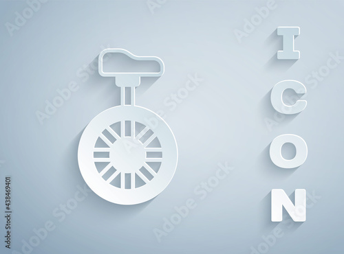 Paper cut Unicycle or one wheel bicycle icon isolated on grey background. Monowheel bicycle. Paper art style. Vector