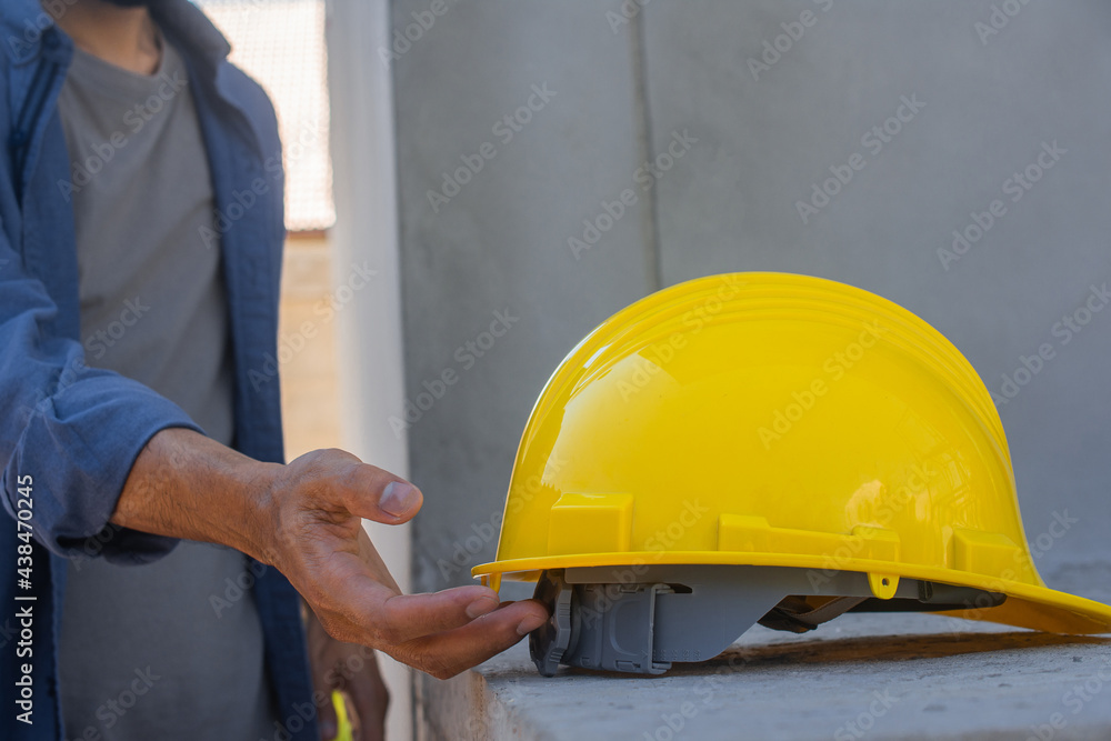 Engineering Engineer Architect holding hard hat helmet working on site building construction Engineering Engineer Architect holding hard hat helmet working on site building construction