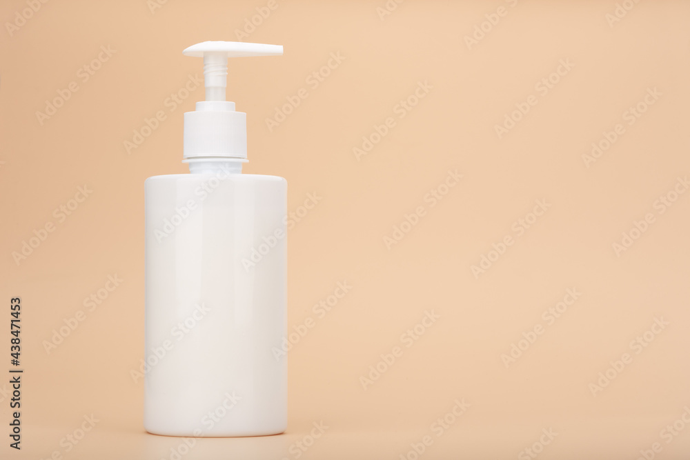 Shower gel, liquid soap or intimate gel in white unbranded tube against light beige background with copy space. Concept of intimate hygiene or gel for sensitive skin Shower gel, liquid soap or intimate gel in white unbranded tube against light beige background with copy space. Concept of intimate hygiene or gel for sensitive skin