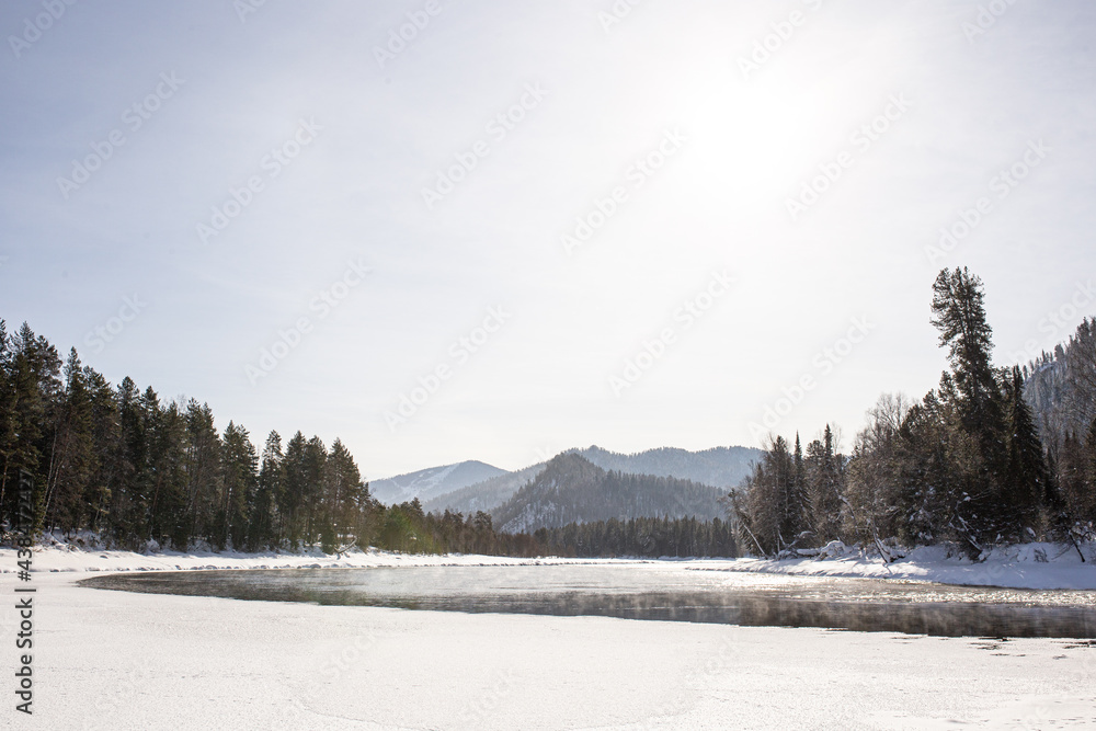 Landscape on a winter sunny day with a river, mixed forest and mountains
Landscape on a winter sunny day with a river, mixed forest and mountains