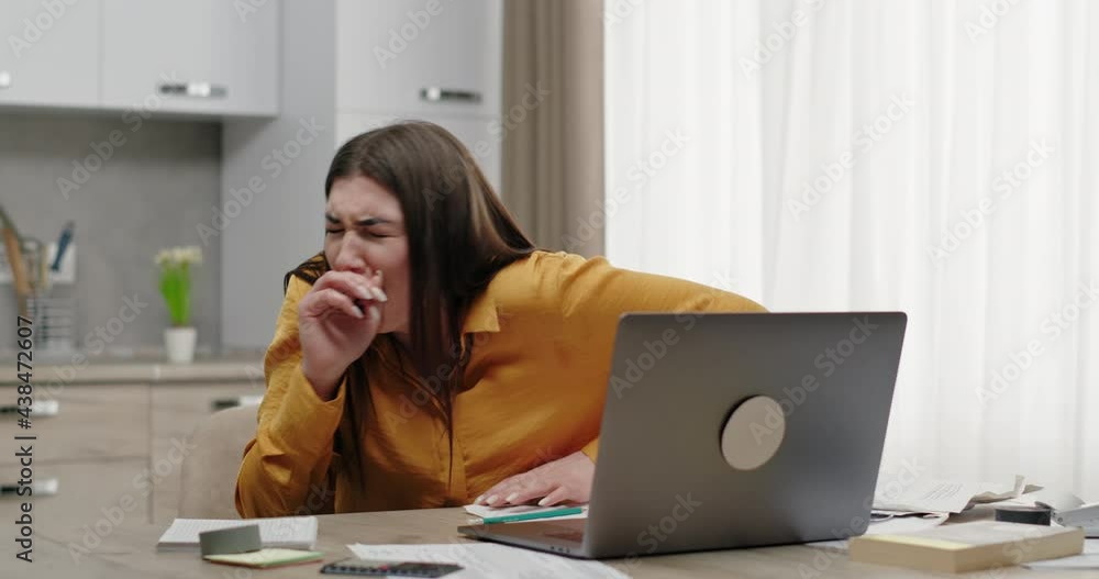 Unhappy woman getting unpleasant news on laptop Unhappy woman getting unpleasant news on laptop
