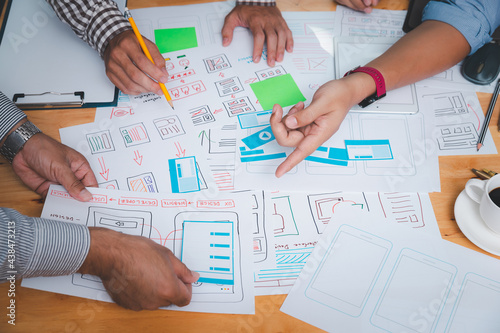 Canvastavla UX or UI designers designing on their smartphone application layout prototype project