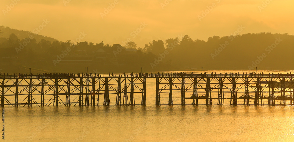 sunrise over the river,Mon Bridge is the longest wooden bridge in Thailand. in Kanchanaburi Province