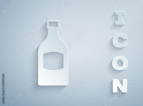 Paper cut Beer bottle icon isolated on grey background. Paper art style. Vector