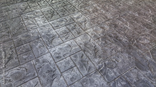 The surface of the road surface that is printed in various shapes on the surface is called this type of surface. concrete stamp floor