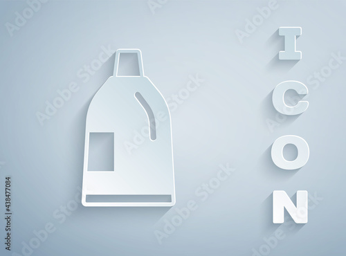 Paper cut Plastic bottle for laundry detergent, bleach, dishwashing liquid or another cleaning agent icon isolated on grey background. Paper art style. Vector