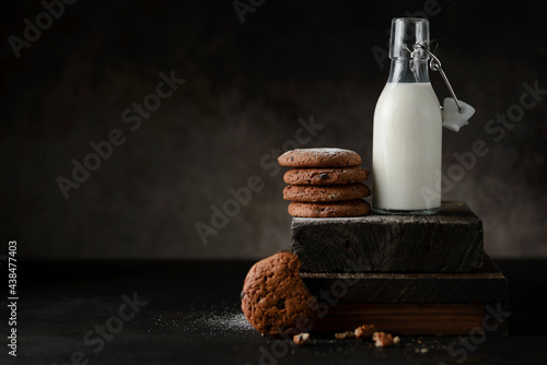 oatmeal cookies and a bottle of milk