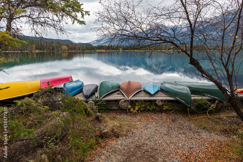 Colorful Canoes in the Rocky Mountains on a pristine lake