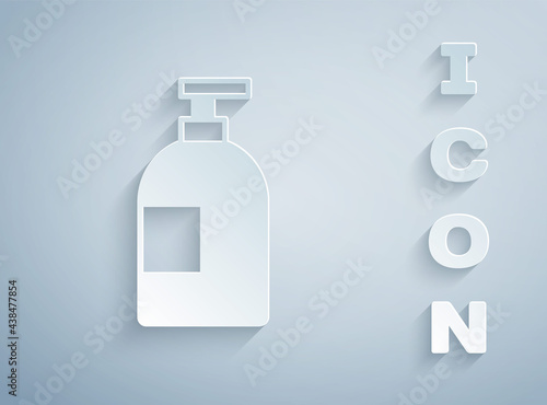 Paper cut Dishwashing liquid bottle icon isolated on grey background. Liquid detergent for washing dishes. Paper art style. Vector