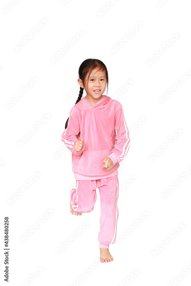 Active little girl in pink tracksuit or sport cloth running isolated on white background. Freedom and sport kid movement concept. Active little girl in pink tracksuit or sport cloth running isolated on white background. Freedom and sport kid movement concept.