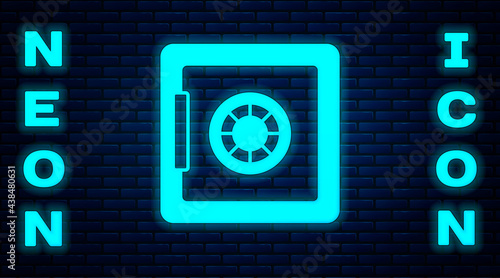 Glowing neon Safe icon isolated on brick wall background. The door safe a bank vault with a combination lock. Reliable Data Protection. Vector