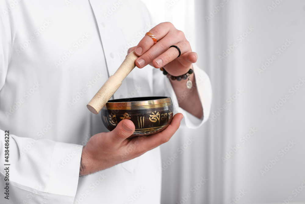 Reiki master working with Tibetan singing bowl Reiki master working with Tibetan singing bowl
