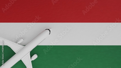 Top Down View of a Plane in the Corner on Top of the Country Flag of Hungary