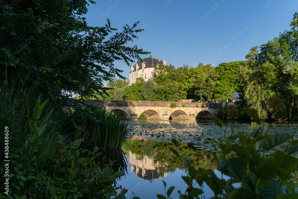 Castle Raoul and bridge with Reflection in Water, Chateauroux city, France Castle Raoul and bridge with Reflection in Water, Chateauroux city, France