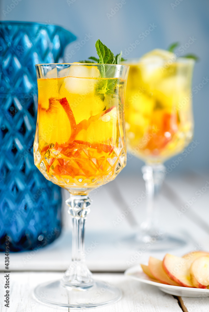 Fototapeta premium Peach juice and blue jug