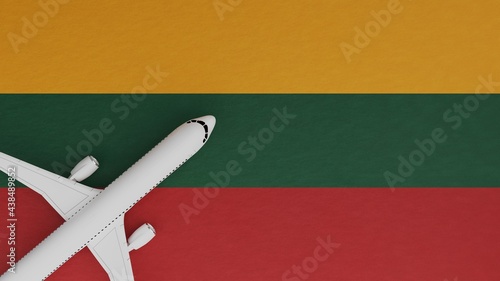 Top Down View of a Plane in the Corner on Top of the Country Flag of Lithuania
