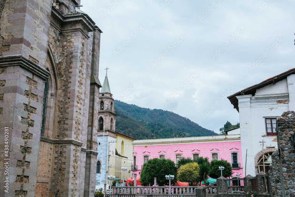 Exteriors, details of the Cathedral of Angangueo, Michoacan, Mexico, as well as some houses and old buildings of the town.