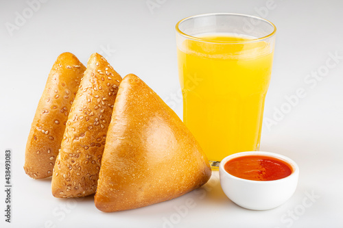 Arabic meat sfiha with juice cop isolated on white background.
