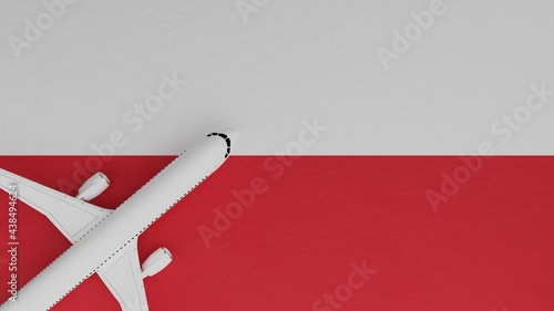 Top Down View of a Plane in the Corner on Top of the Country Flag of Poland