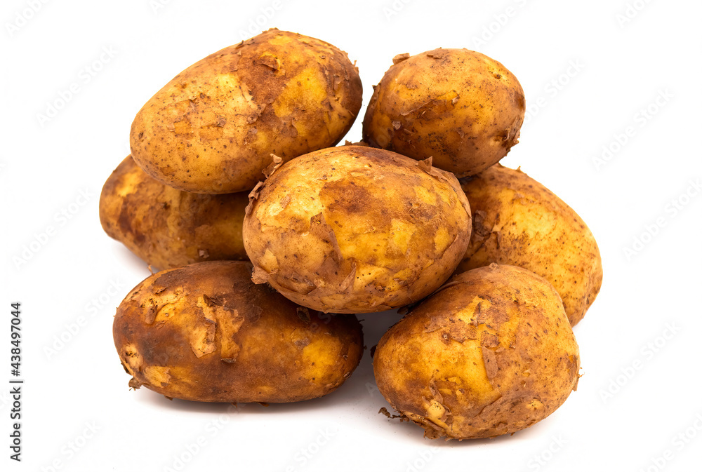 A handful of new potatoes isolated on a white background A handful of new potatoes isolated on a white background